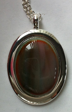 A larger photo of the Multicolored Brown & Orange Swirl Oval in Silver-plated Setting