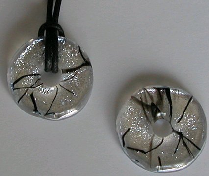 A larger photo of the Silver and Black Stringer Glass Donut Necklace