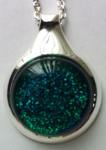 Click for a larger photo of the Clear Glass on Bluish Green Sparkle Round in Silver-plated Setting