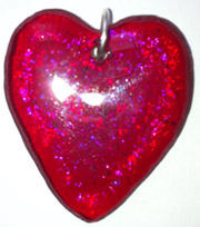 Click for a larger photo of the Clear Glass on Iridescent Red Heart Shaped Necklace