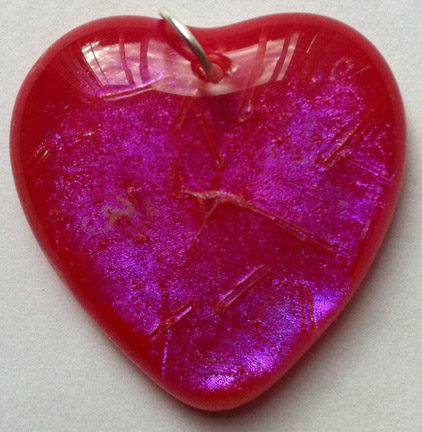 A larger photo of the Clear Pink on Red Glass Heart Shaped Necklace