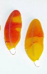 Click for a larger photo of the Red Swirl on Yellow Glass Feather Magnet