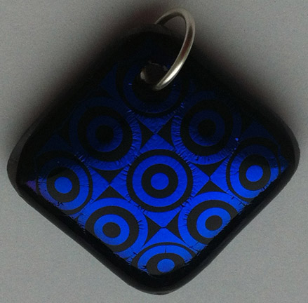 A larger photo of the Textured Purplish Blue Bullseye Patterned Square Diamond Shaped Necklace